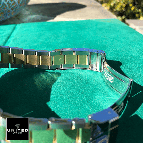 Rolex Submariner 16613 Two Tone Stainless Steel Gold Diamond Replica on the table